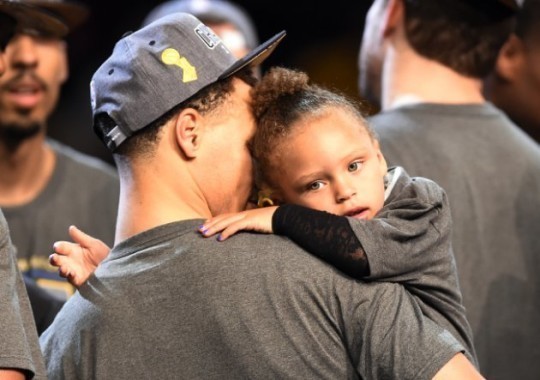 Jun 16, 2015; Cleveland, OH, USA; Golden State Warriors guard Stephen Curry (30) holds his daughter Riley Curry after beating the Cleveland Cavaliers in game six of the NBA Finals at Quicken Loans Arena. Mandatory Credit: Bob Donnan-USA TODAY Sports