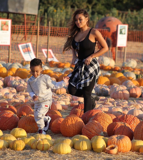 Daphne Joy and son Sire Jackson go pumpkin picking.