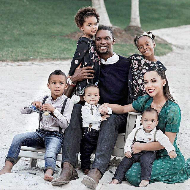 Chris Bosh and family pose in new Holiday photos.