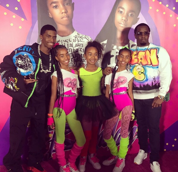 The twins pose next to dad Diddy, brother Christian Combs and sister Chance Combs.