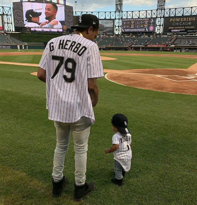 G HERBO THROWS FIRST PITCH WITH HIS BABY BOY AT CHICAGO WHITE SOX GAME