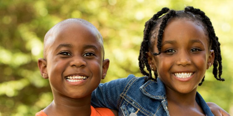 African American kids smiling.