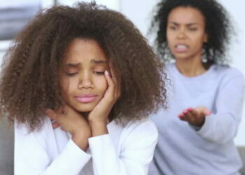 Sad teen african american girl upset by strict mum arguing scolding daughter, stressed stubborn teenager turned back ignoring angry black mother lecturing difficult kid, parent and children conflicts