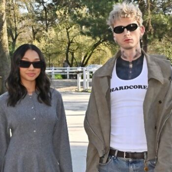 MACHINE GUN KELLY ATTENDS PARIS FASHION WEEK WITH DAUGHTER CASIE COLSON BAKER